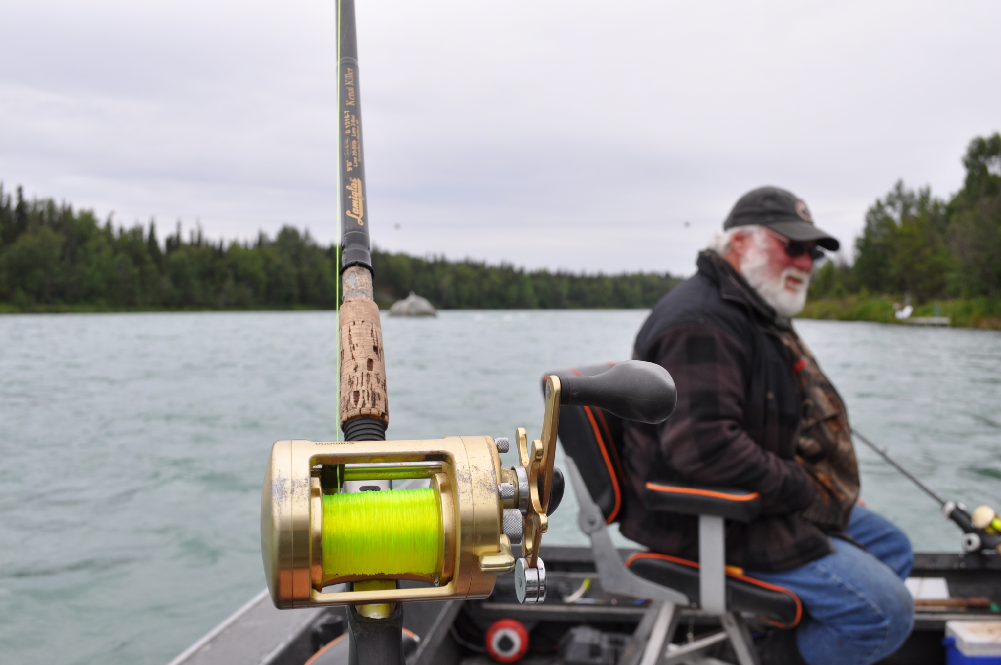 Wisherman in boat with wishing rod